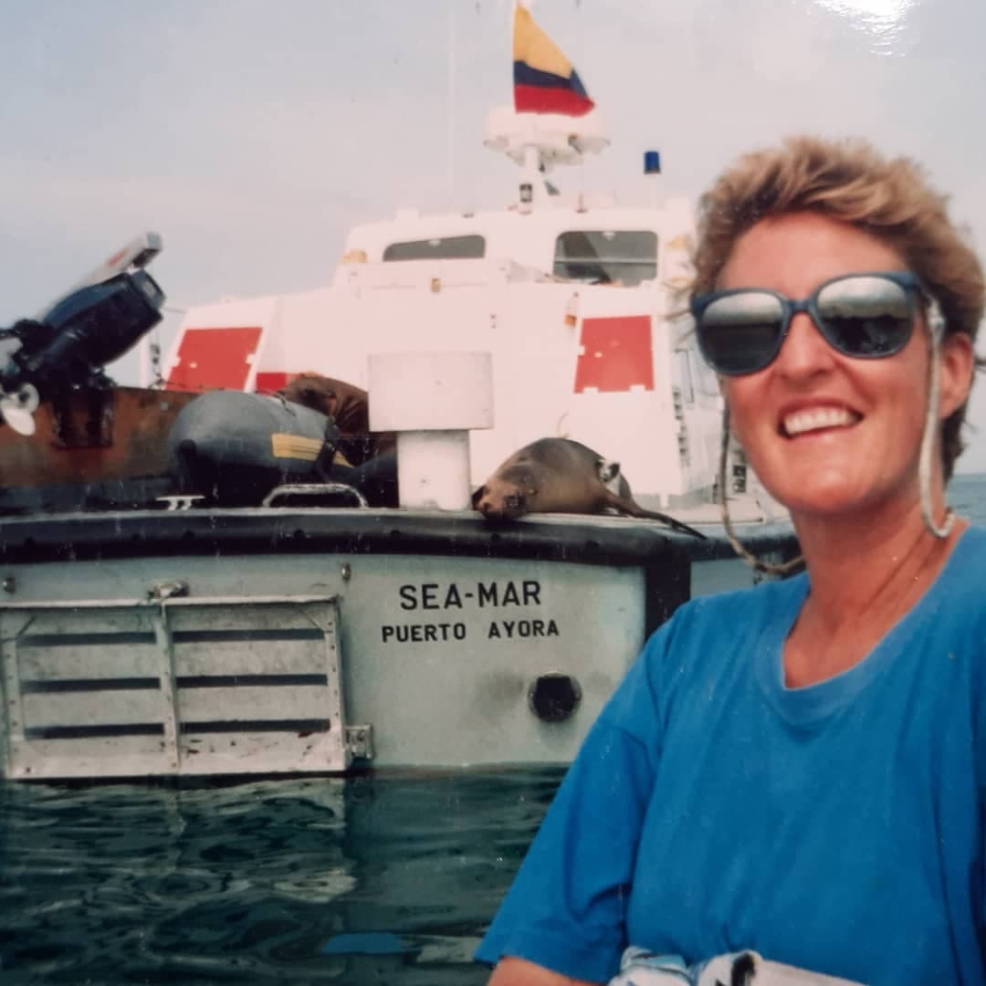 /12c Ecuador to Galapagos margie infront of boat.jpg