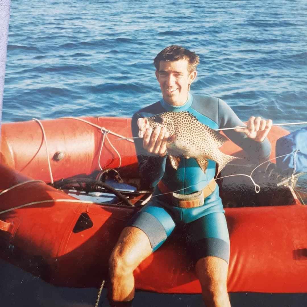 /17d Mopelia Atoll and Aitutaki Cook Islands Glenn on boat with fish.jpg