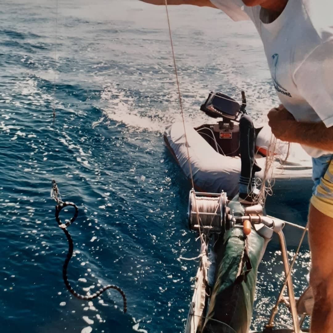 /18c Tonga fiji Glenn catching sea snake on boat.jpg